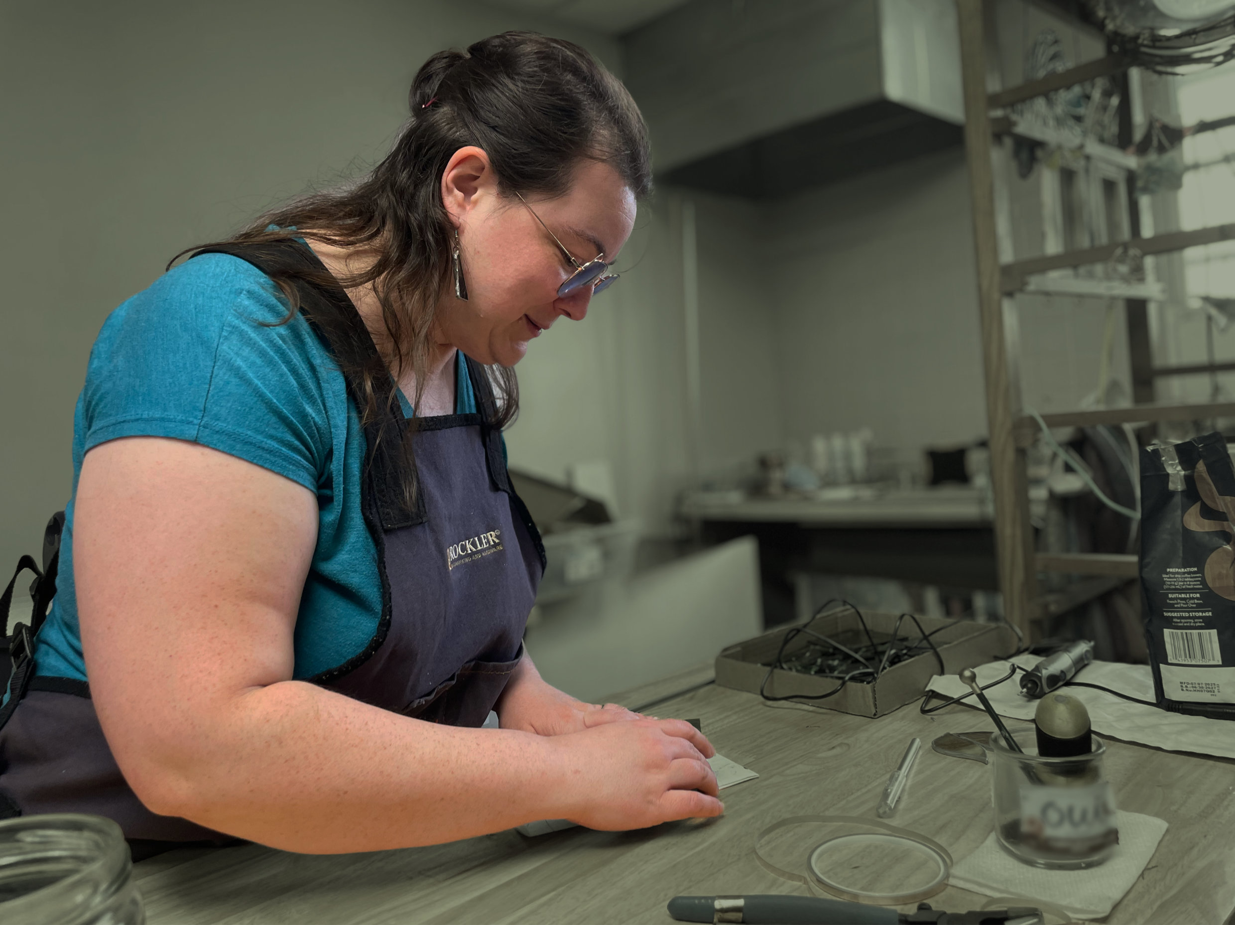 Holly Harris crafting glass in her workshop